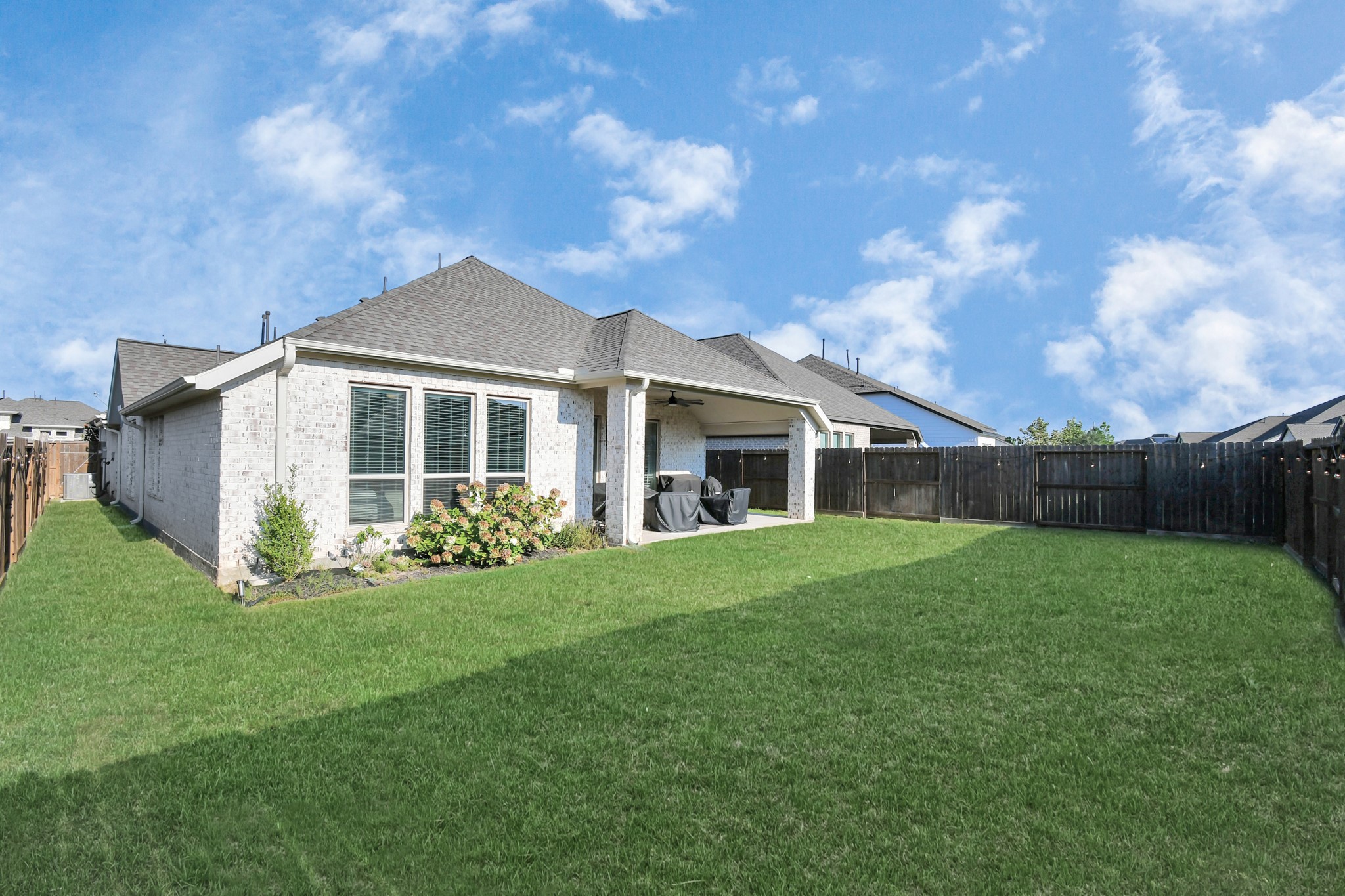 10522 Rigel Rdg Way Richmond, TX 77406 - Photo 33 of 41 a front view of a house with a garden