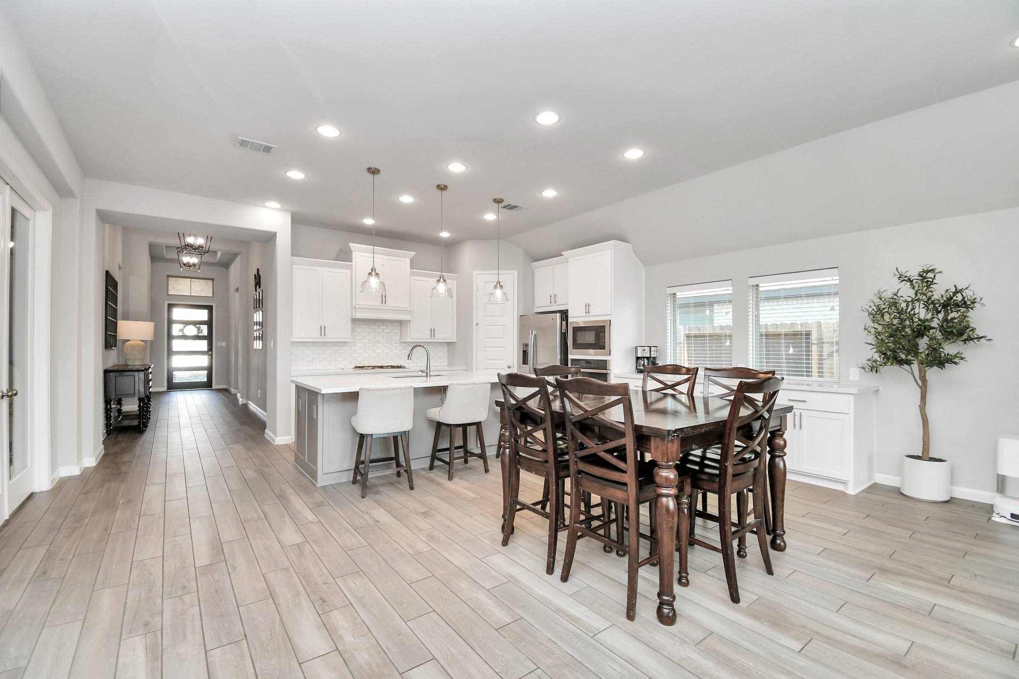 10522 Rigel Rdg Way Richmond, TX 77406 - Photo 8 of 41 a view of a dining room with furniture and wooden floor