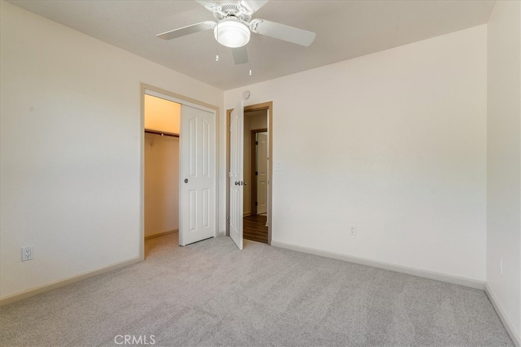9305 Santa Lucia Road Atascadero, CA 93422 - Photo 20 of 41 an empty room with a ceiling fan and a window