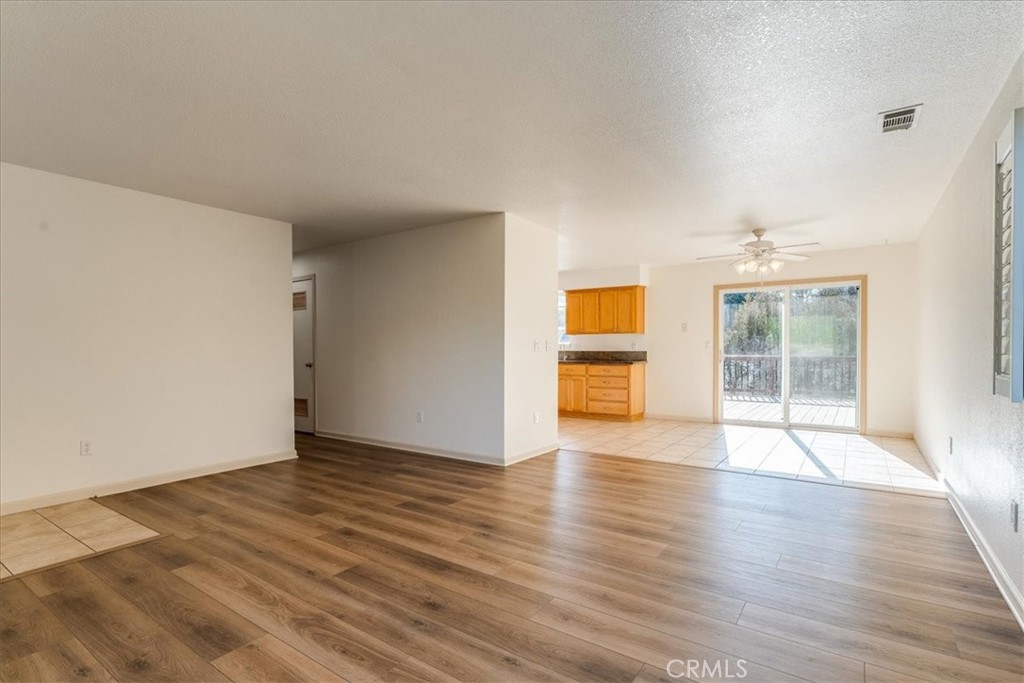 9305 Santa Lucia Road Atascadero, CA 93422 - Photo 7 of 41 a view of an empty room with wooden floor and a window