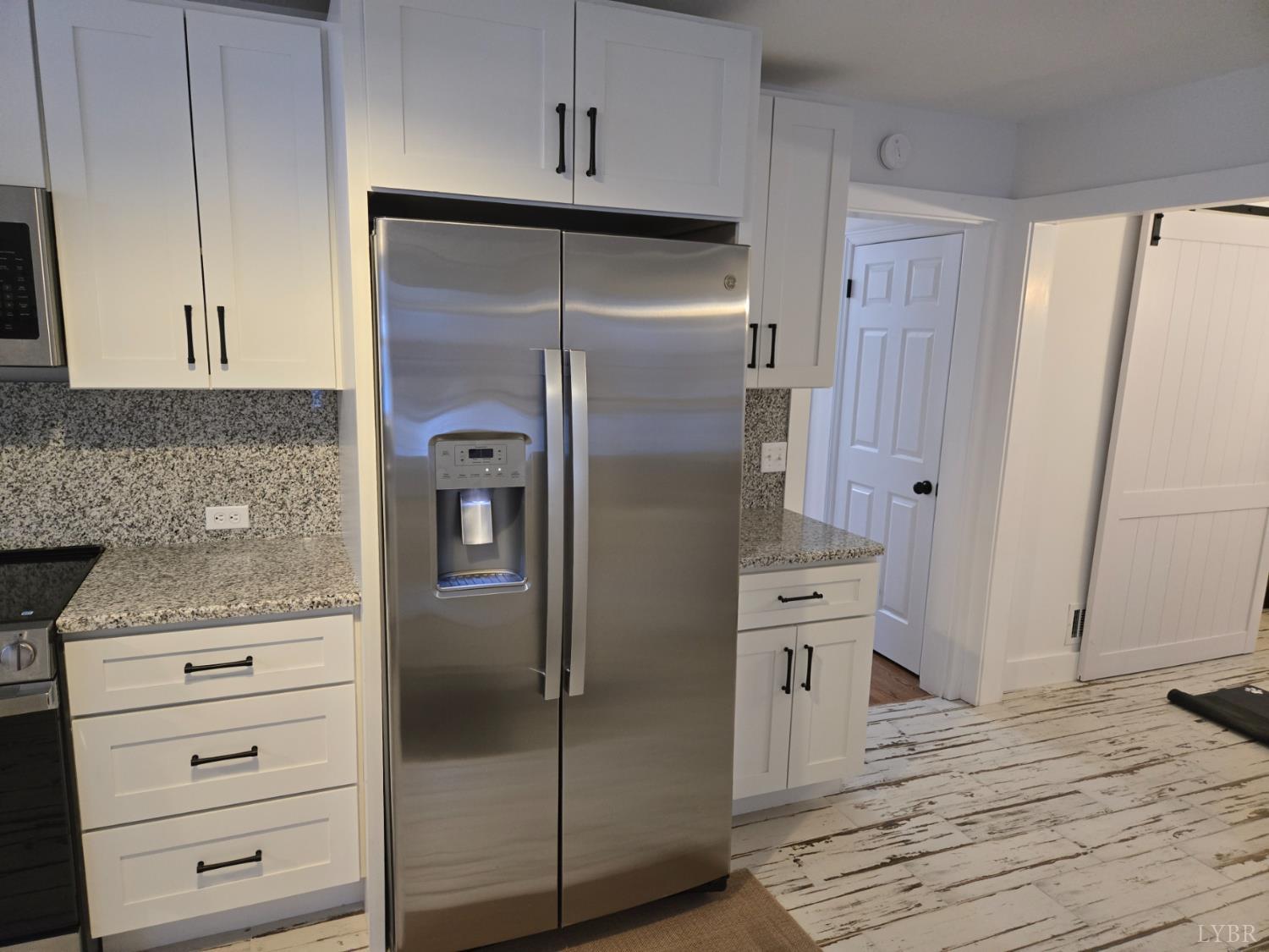 4015 White House Road Moneta, VA 24121 - Photo 14 of 35 a kitchen with stainless steel appliances a refrigerator and a stove
