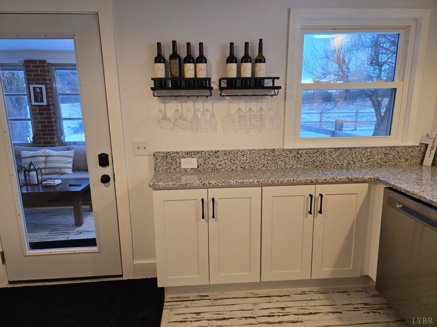4015 White House Road Moneta, VA 24121 - Photo 18 of 35 a view of kitchen with granite countertop cabinets and a wooden floor