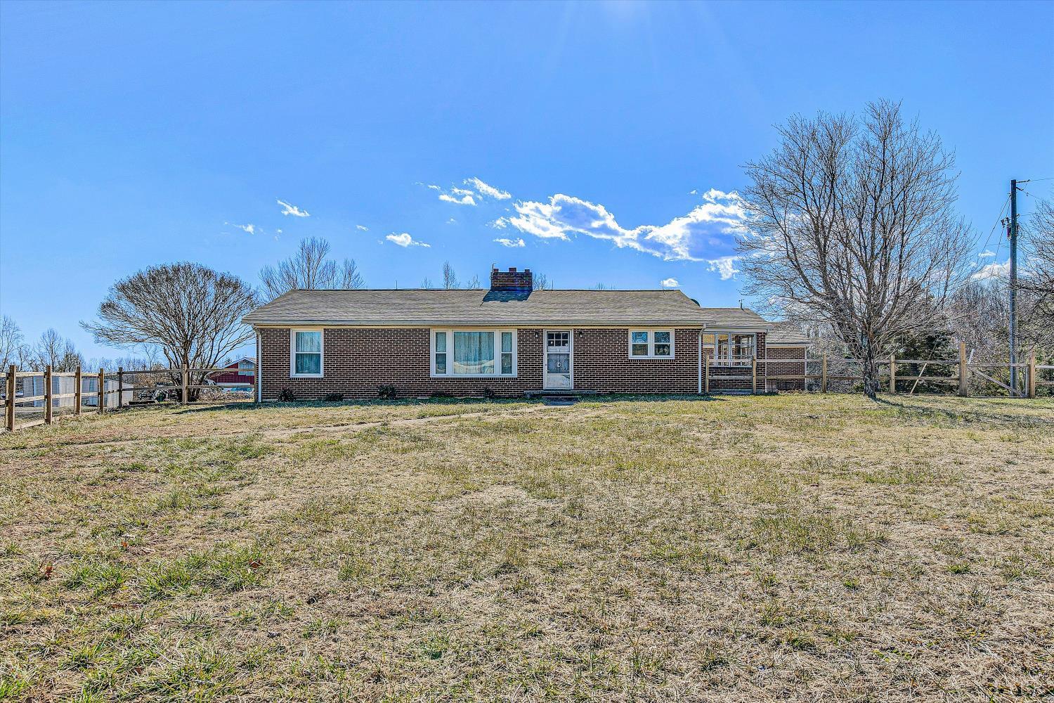 4015 White House Road Moneta, VA 24121 - Photo 2 of 35 a front view of a house with a yard