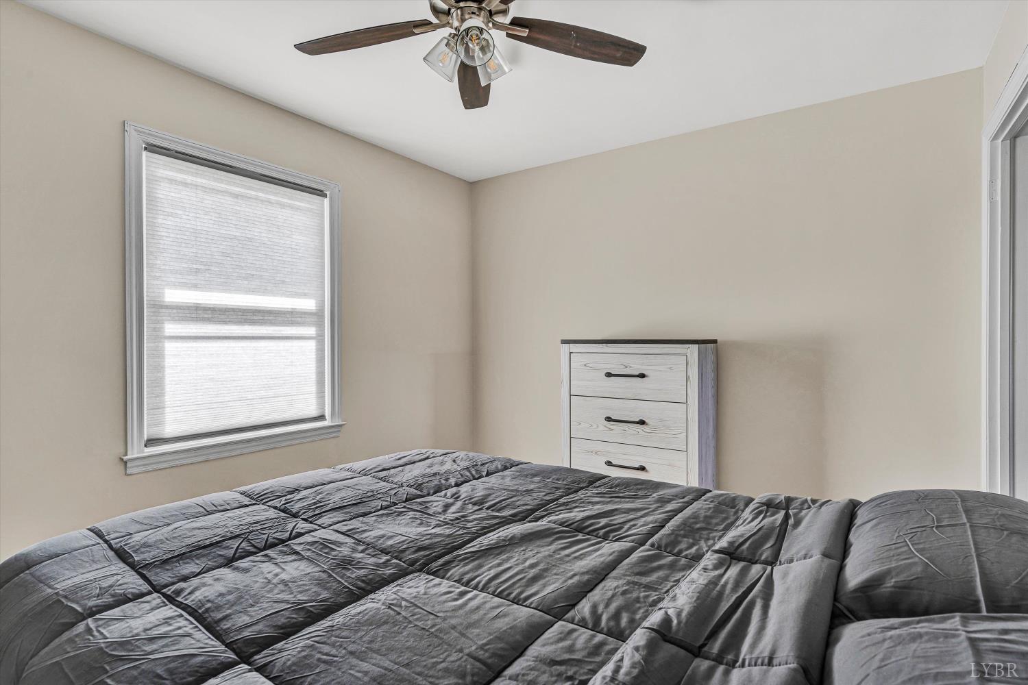 4015 White House Road Moneta, VA 24121 - Photo 23 of 35 a bedroom with a bed and a window