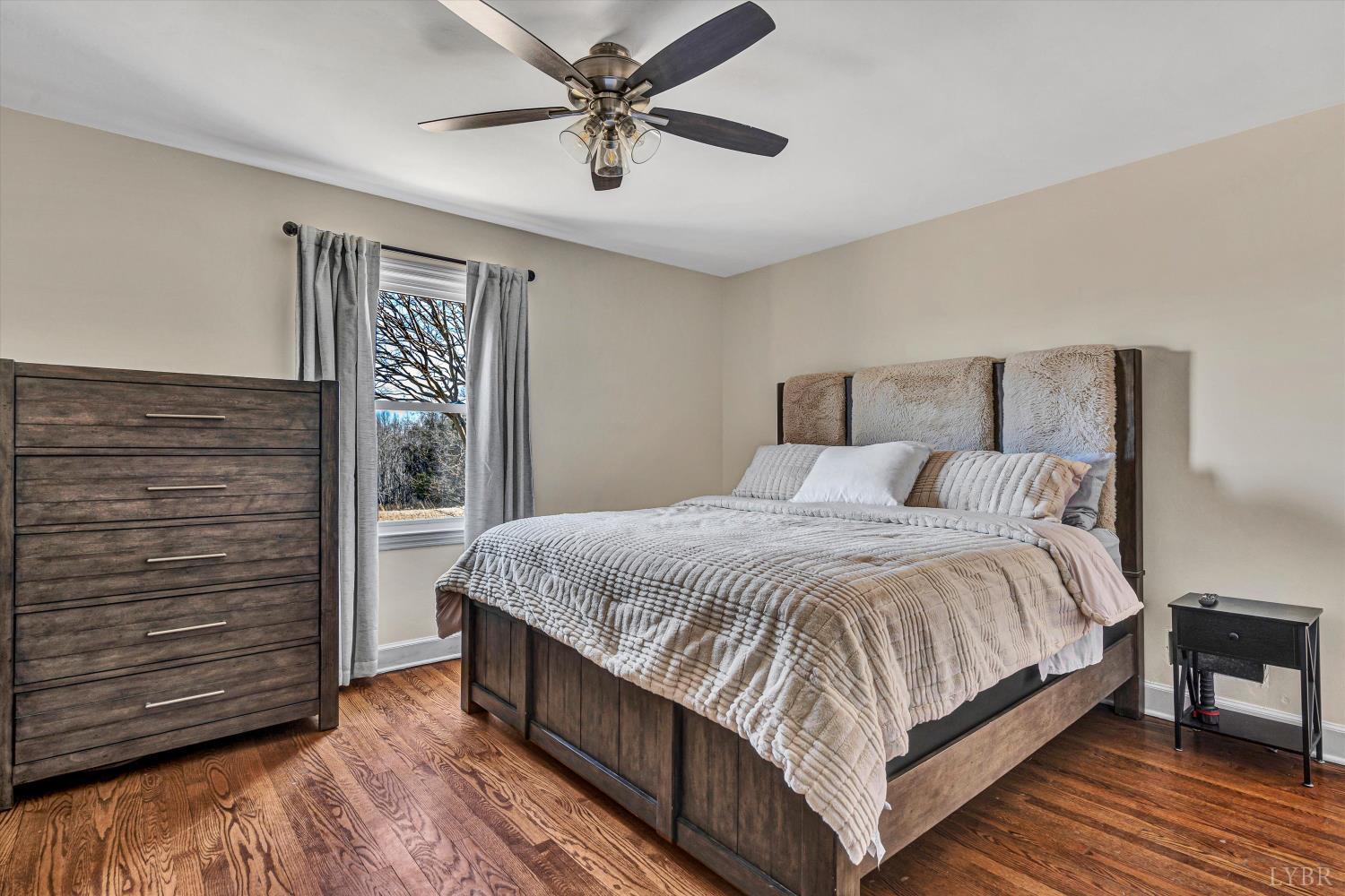 4015 White House Road Moneta, VA 24121 - Photo 27 of 35 a large bedroom with wooden floor