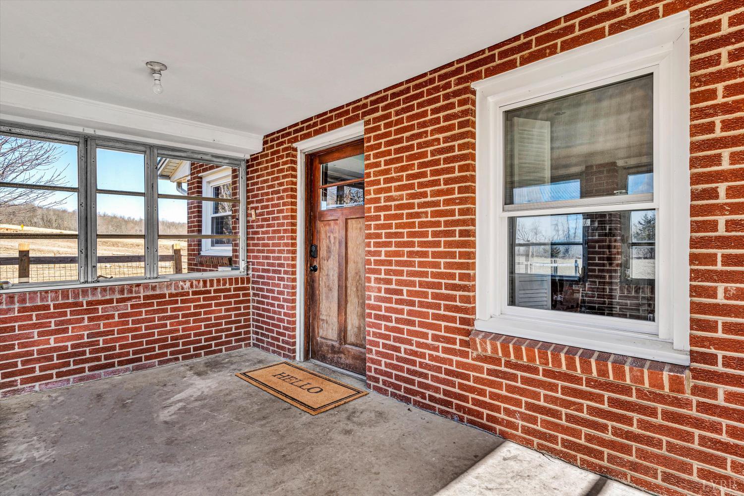 4015 White House Road Moneta, VA 24121 - Photo 28 of 35 a view of a brick house with large windows