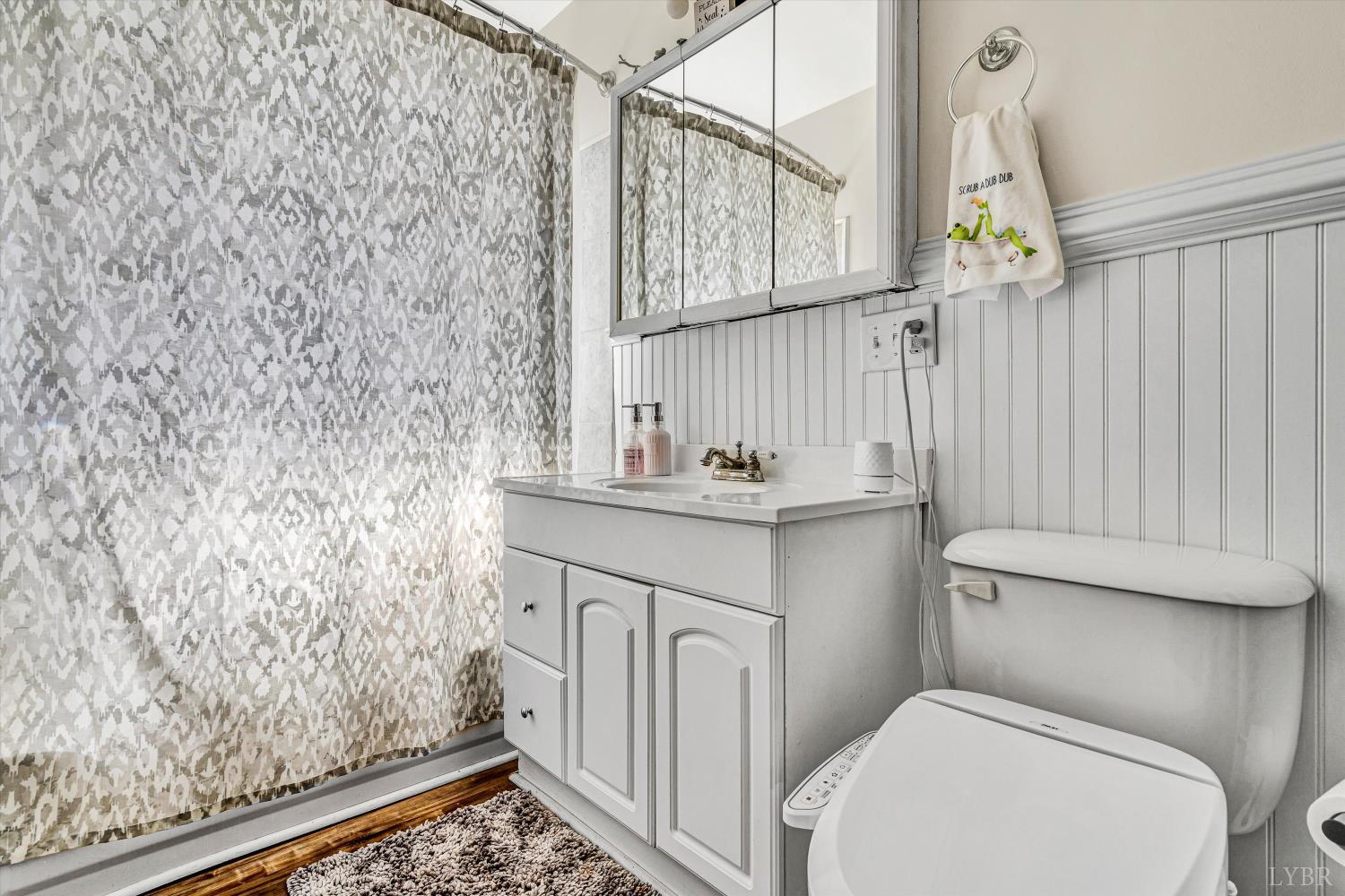 4015 White House Road Moneta, VA 24121 - Photo 28 of 35 a bathroom with a sink a toilet and shower