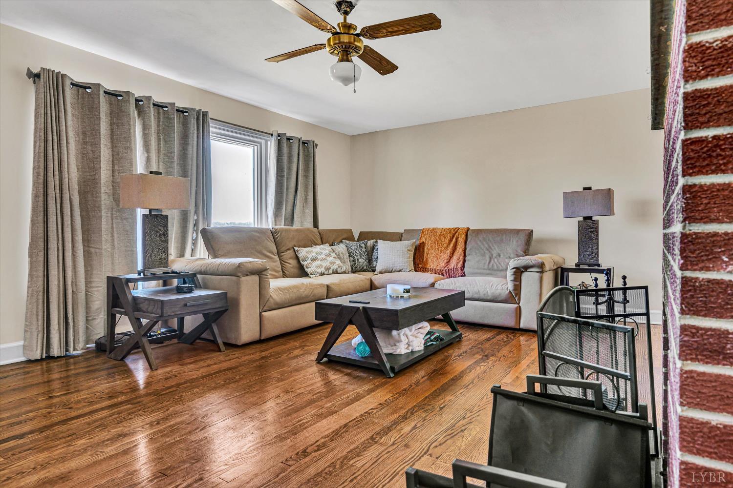 4015 White House Road Moneta, VA 24121 - Photo 7 of 35 a living room with furniture and a wooden floor