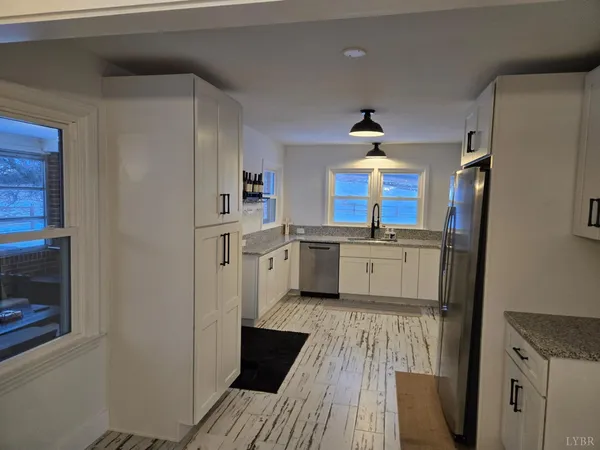 a kitchen with stainless steel appliances a refrigerator and a stove