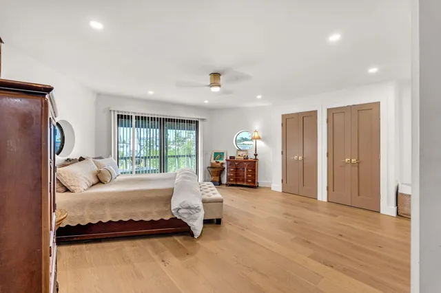 a bed room with furniture and a window