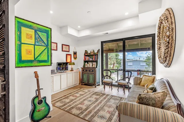 a view of a dining room with furniture and chandelier
