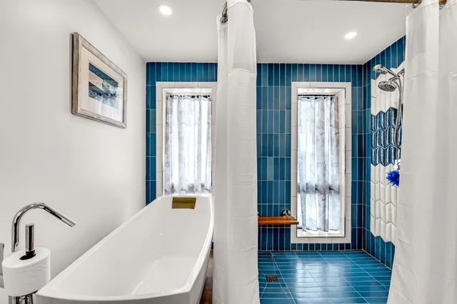 a bedroom with a bed and a tv