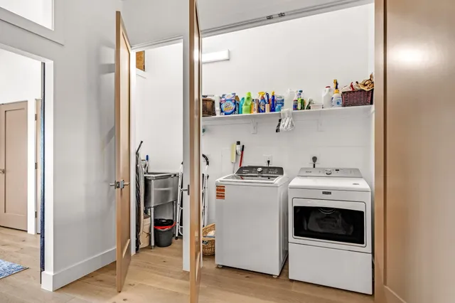 a spacious bathroom with a sink toilet and shower