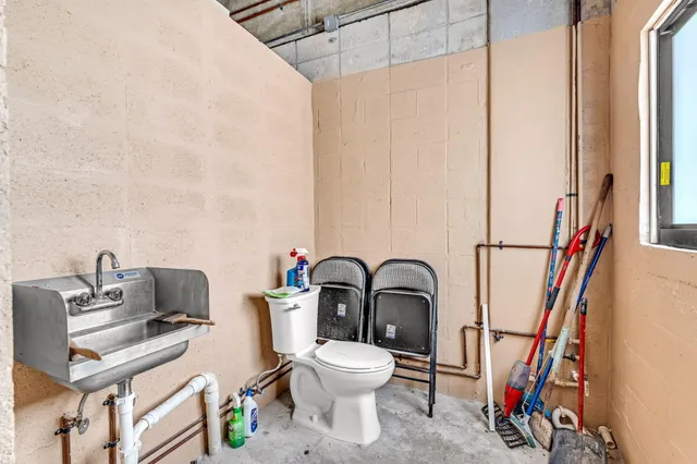 a view of a balcony with couch and wooden floor