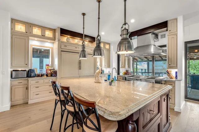 a dining table with chairs and window