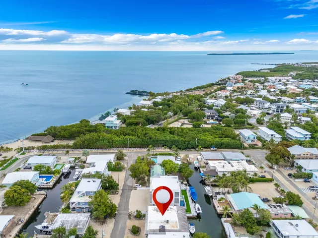 a bathroom with a toilet a sink and a mirror