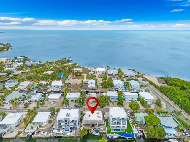 a view of a lake with a patio and a garden