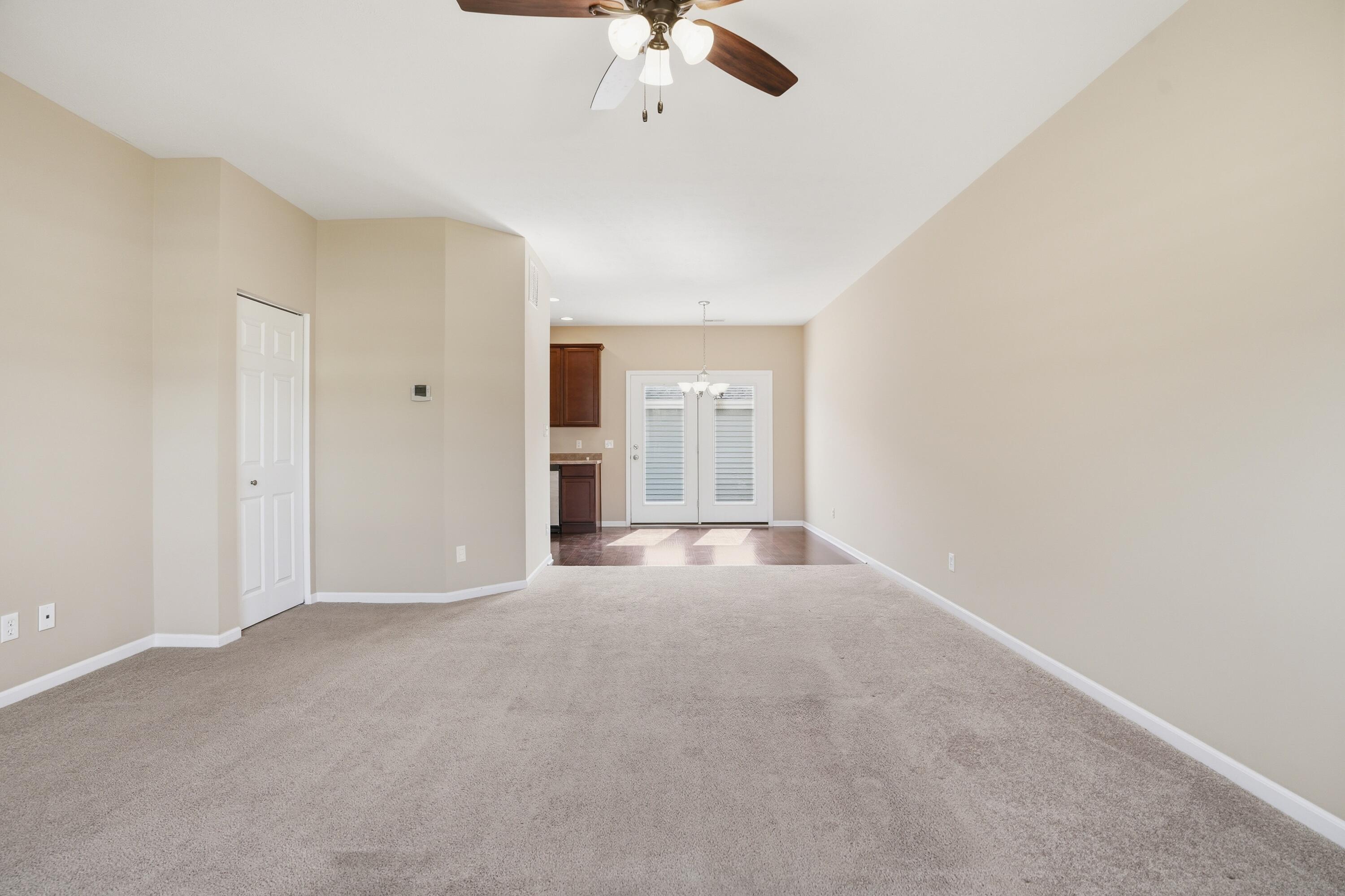 11351 Rhode Island Street Crown Point, IN 46307 - Photo 11 of 18 a view of an empty room with a ceiling fan