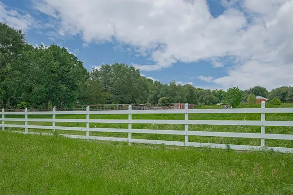 a view of outdoor space with deck and yard