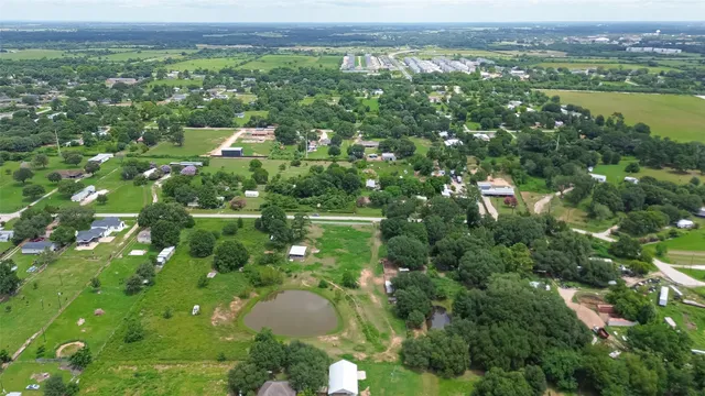 a view of a city with lush green forest