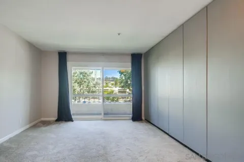 a room with a sink vanity and mirror