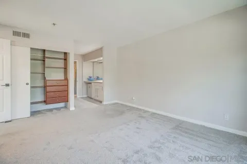 a bathroom with a sink mirror vanity and toilet