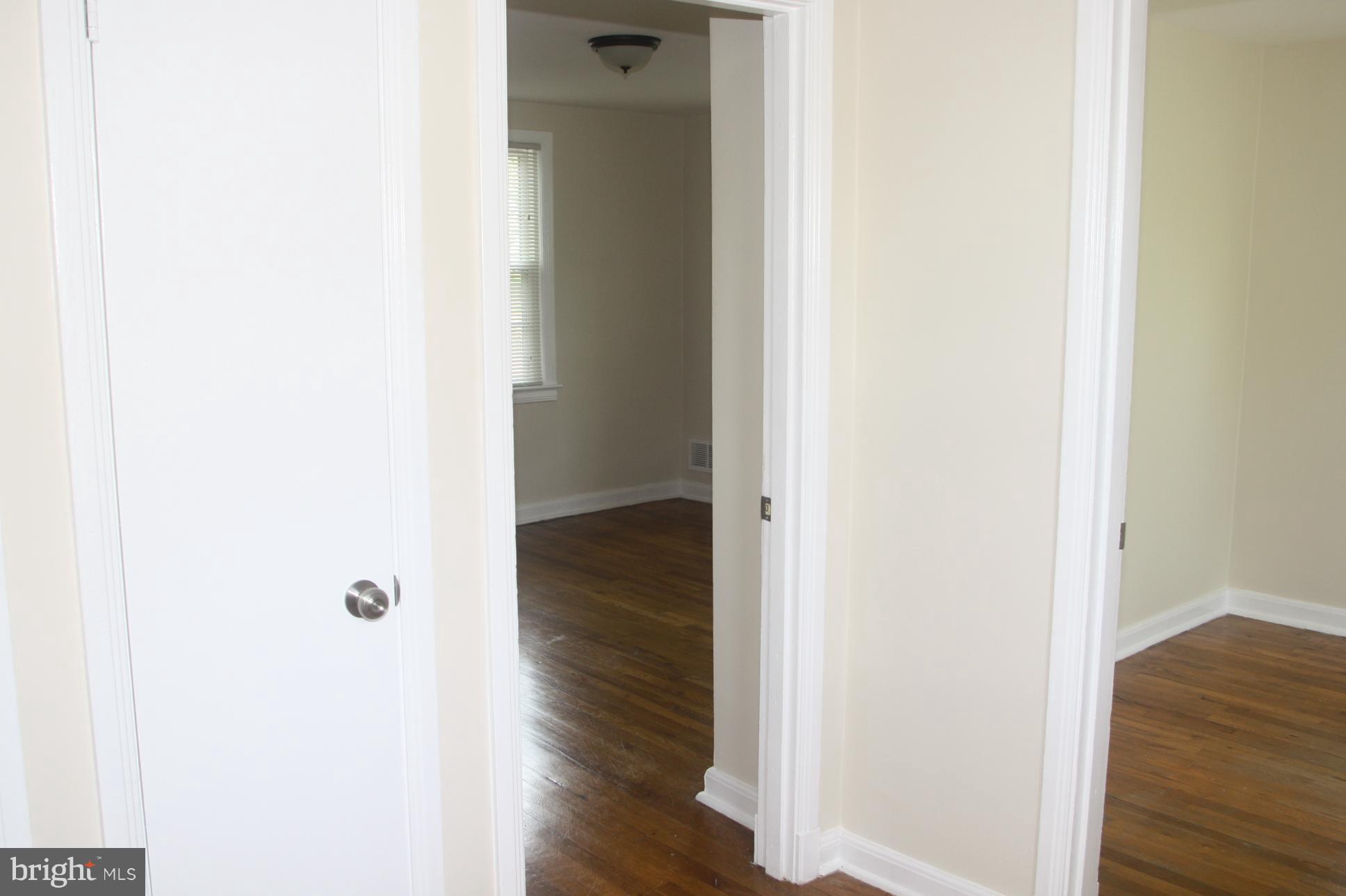 604 Ritchie Avenue Silver Spring, MD 20910 - Photo 8 of 11 a view of a hallway with wooden floor