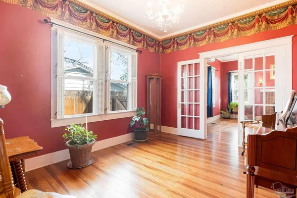 a view of a porch with wooden floor and chair