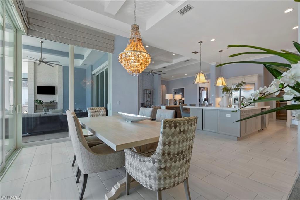 6250 Lightbourn Way Naples, FL 34113 - Photo 12 of 40 a view of a dining room with furniture
