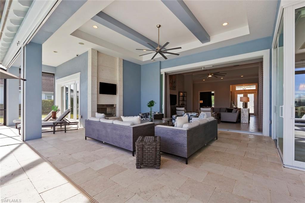 6250 Lightbourn Way Naples, FL 34113 - Photo 13 of 40 a living room with furniture and a large window