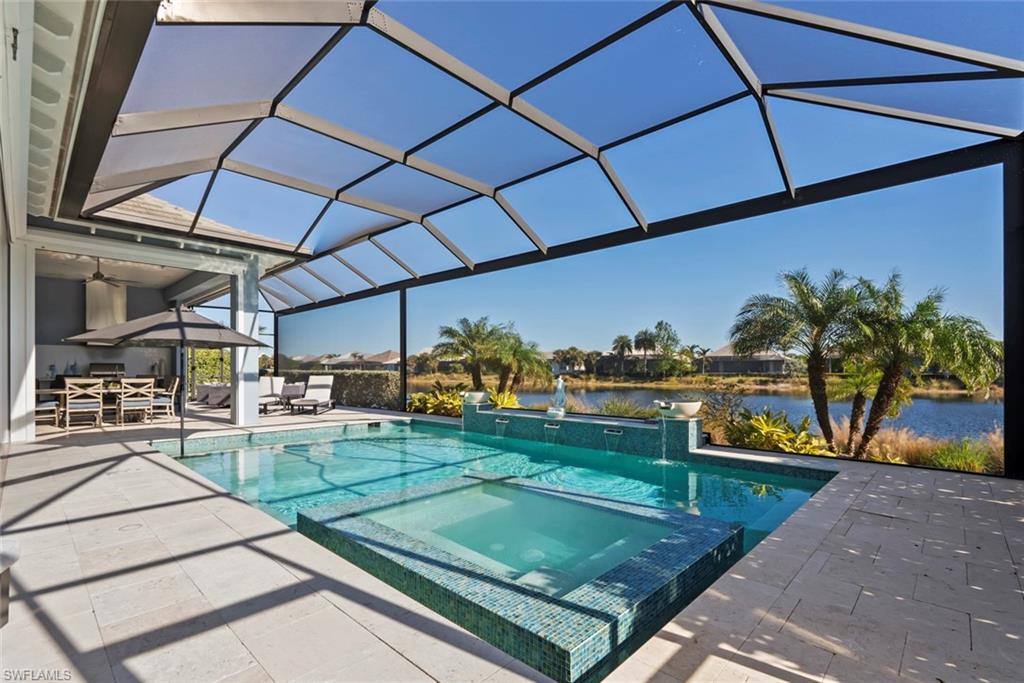 6250 Lightbourn Way Naples, FL 34113 - Photo 18 of 40 a view of a backyard with sitting area