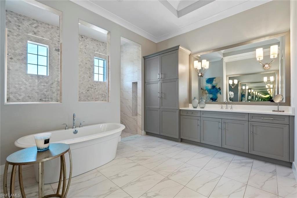 6250 Lightbourn Way Naples, FL 34113 - Photo 25 of 40 a bathroom with a double vanity sink mirror and
