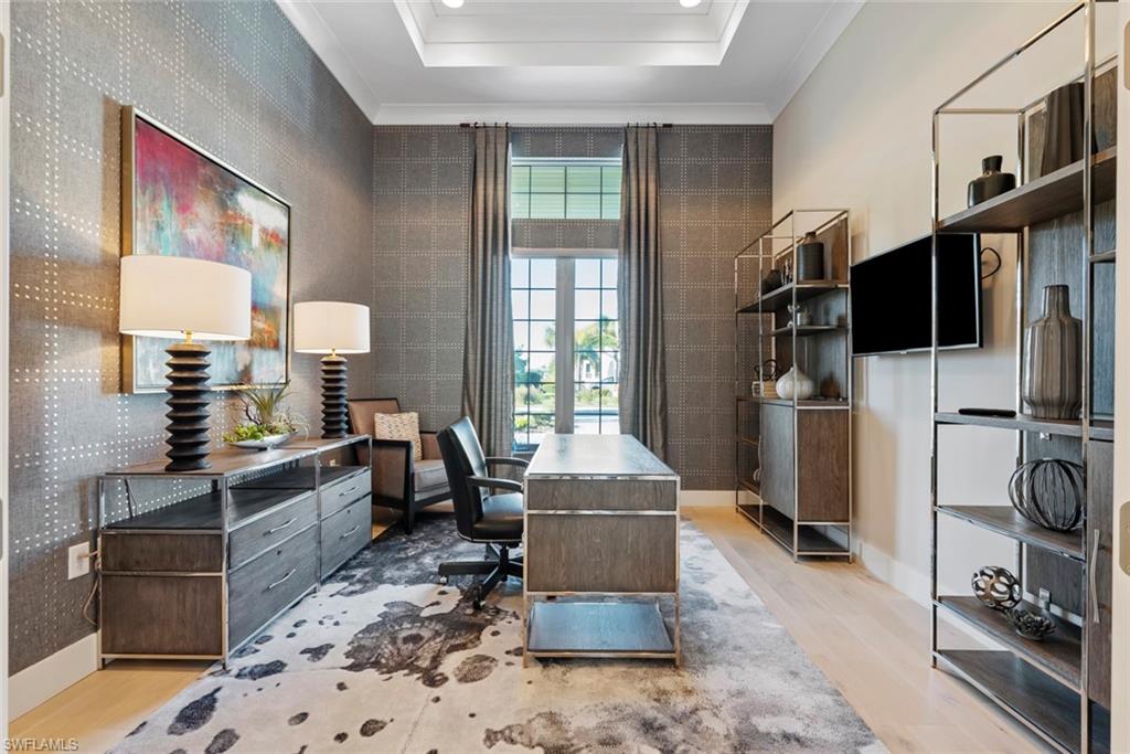 6250 Lightbourn Way Naples, FL 34113 - Photo 26 of 40 a living room with furniture a flat screen tv and a refrigerator
