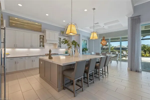 a kitchen with center island and stainless steel appliances