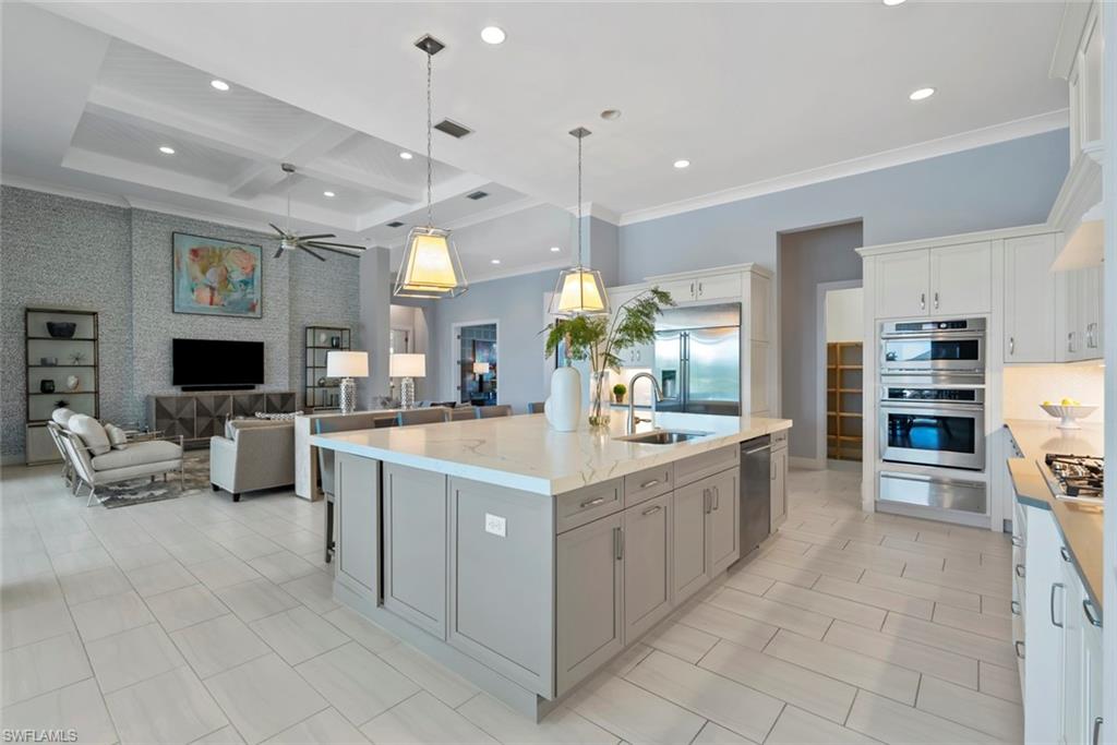 6250 Lightbourn Way Naples, FL 34113 - Photo 9 of 40 a large kitchen with stainless steel appliances lots of counter top space