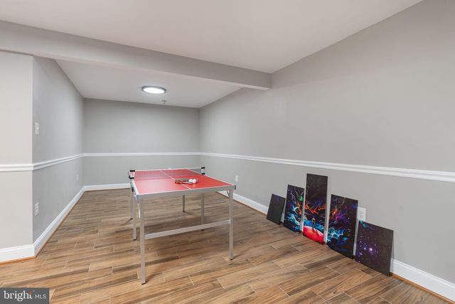 a view of a room with wooden floor and closet