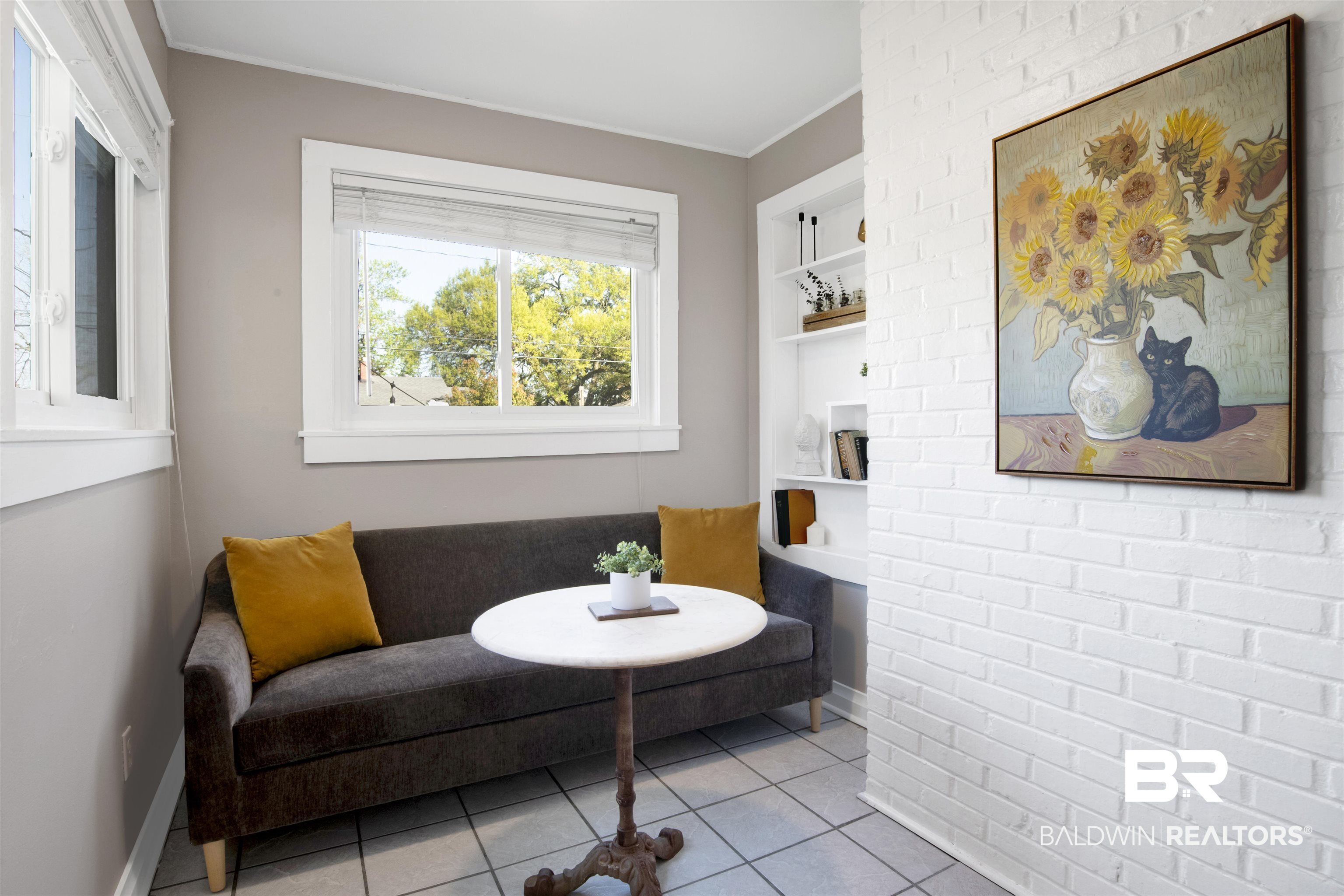160 Emogene Place Mobile, AL 36606 - Photo 11 of 32 Breakfast area featuring brick wall, built in shelves, and light tile patterned floors
