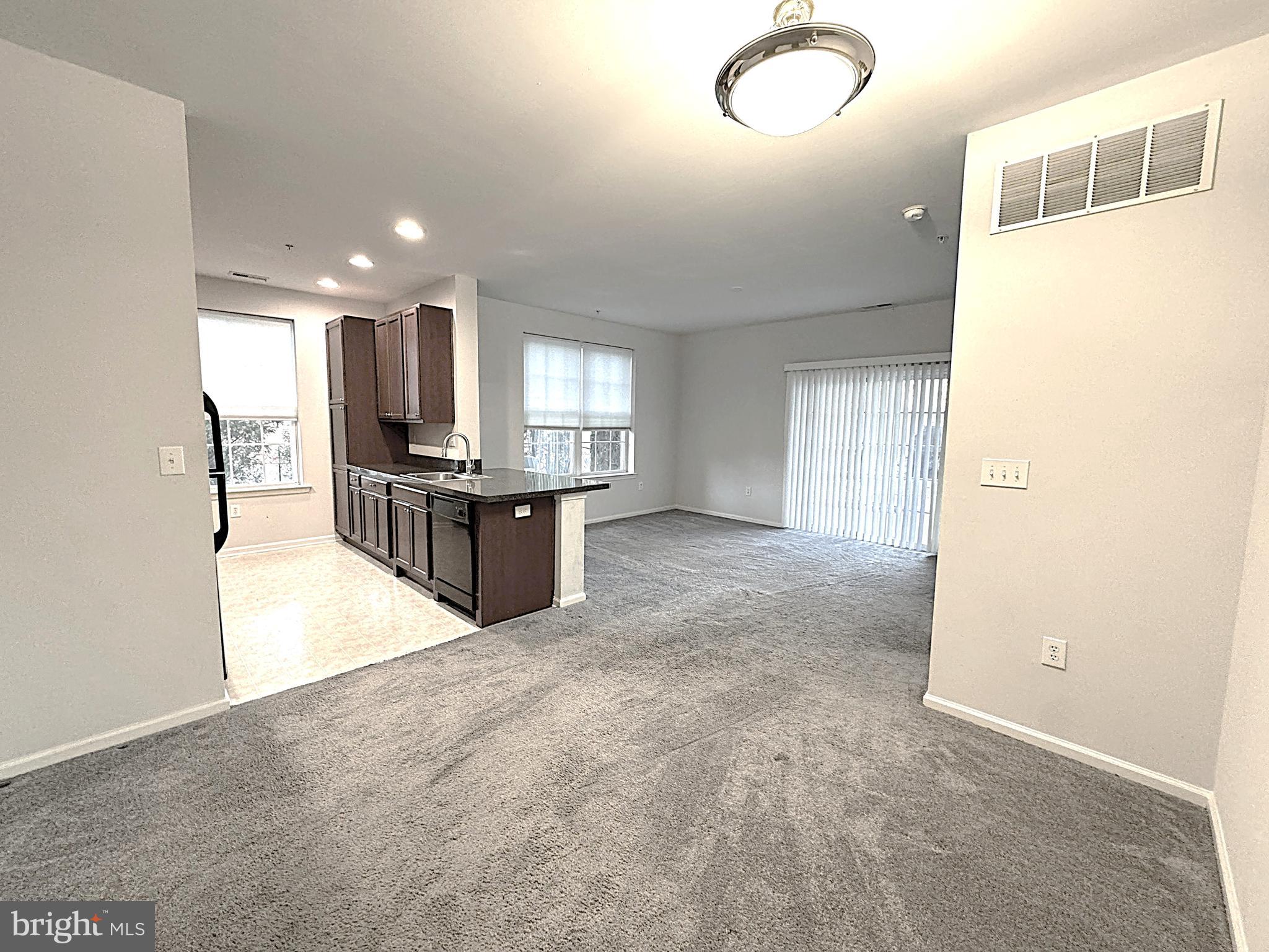 417 Highland Estates Clementon, NJ 08021 - Photo 4 of 10 a view of a kitchen with refrigerator and a sink