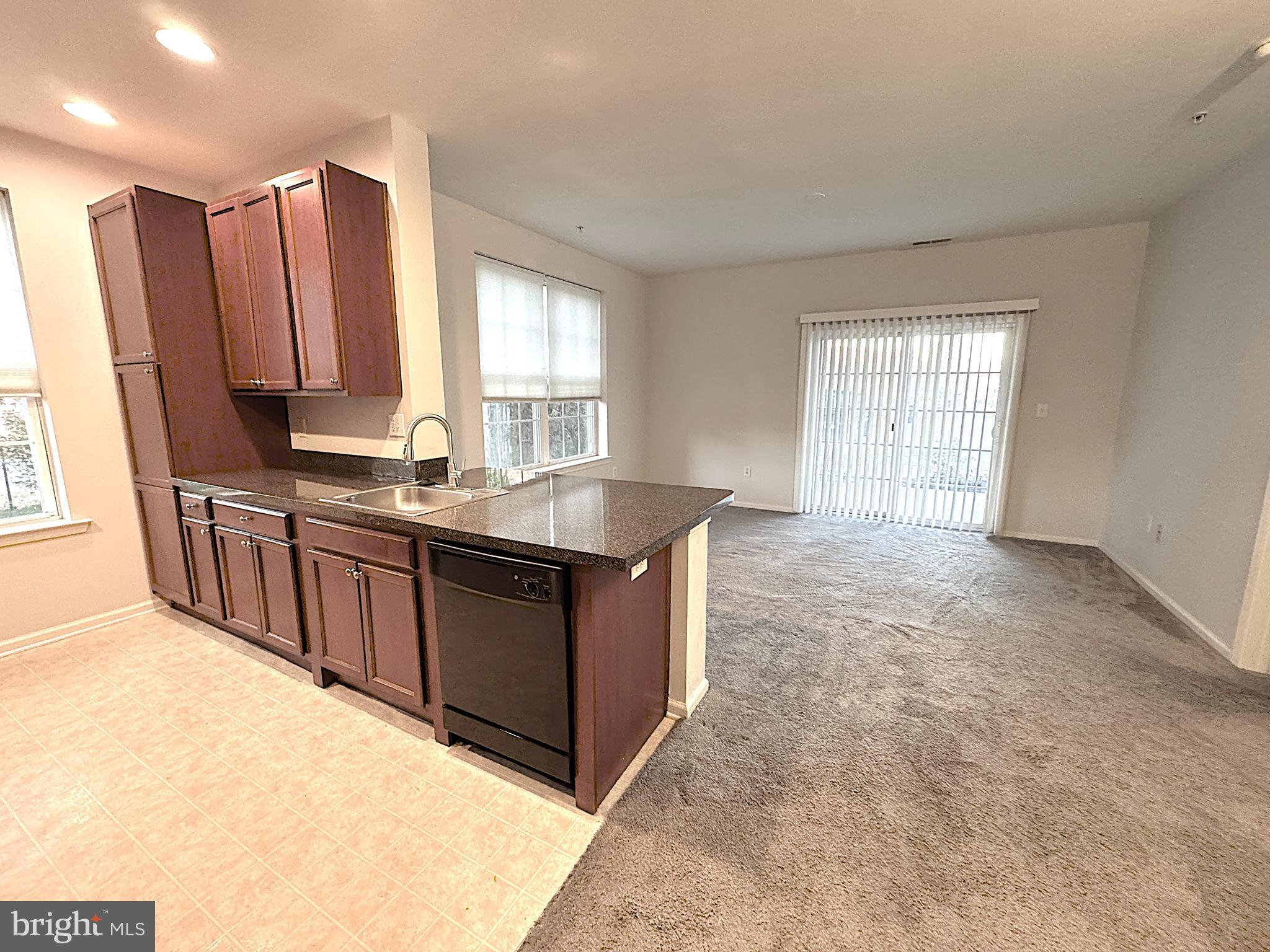 417 Highland Estates Clementon, NJ 08021 - Photo 6 of 10 a kitchen with stainless steel appliances granite countertop a stove a sink and a refrigerator