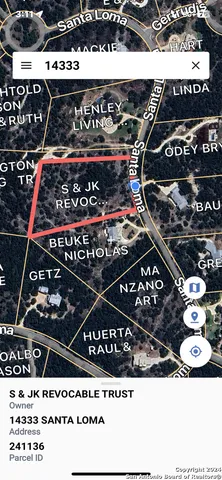 a view of a city with lush green forest