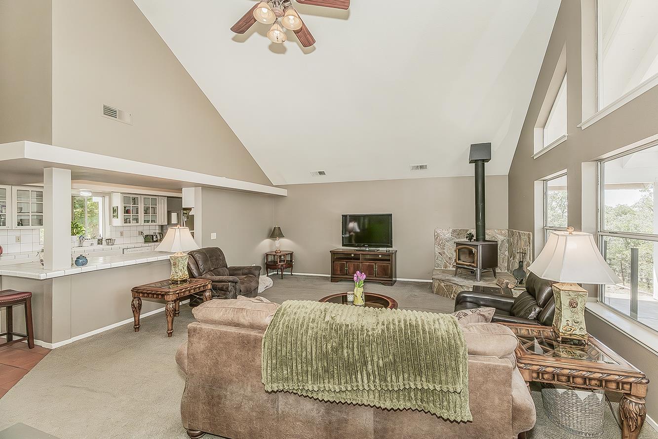 14815 Garlock Lane Prather, CA 93651 - Photo 11 of 80 a living room with fireplace furniture and a large window