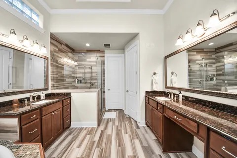 a kitchen with a sink stove and cabinets