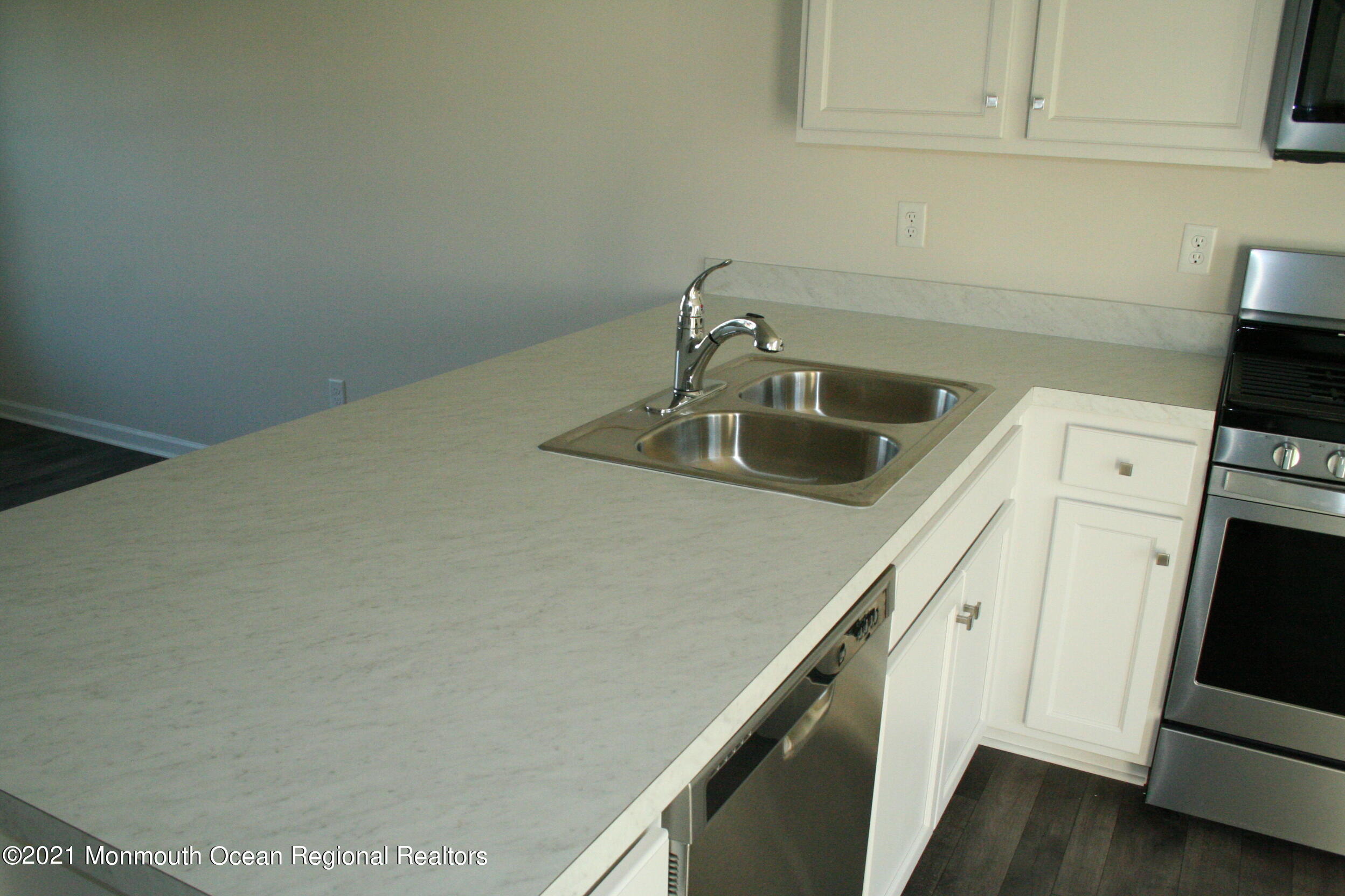 107 Cox Road Barnegat, NJ 08005 - Photo 13 of 44 a kitchen with a sink and cabinets