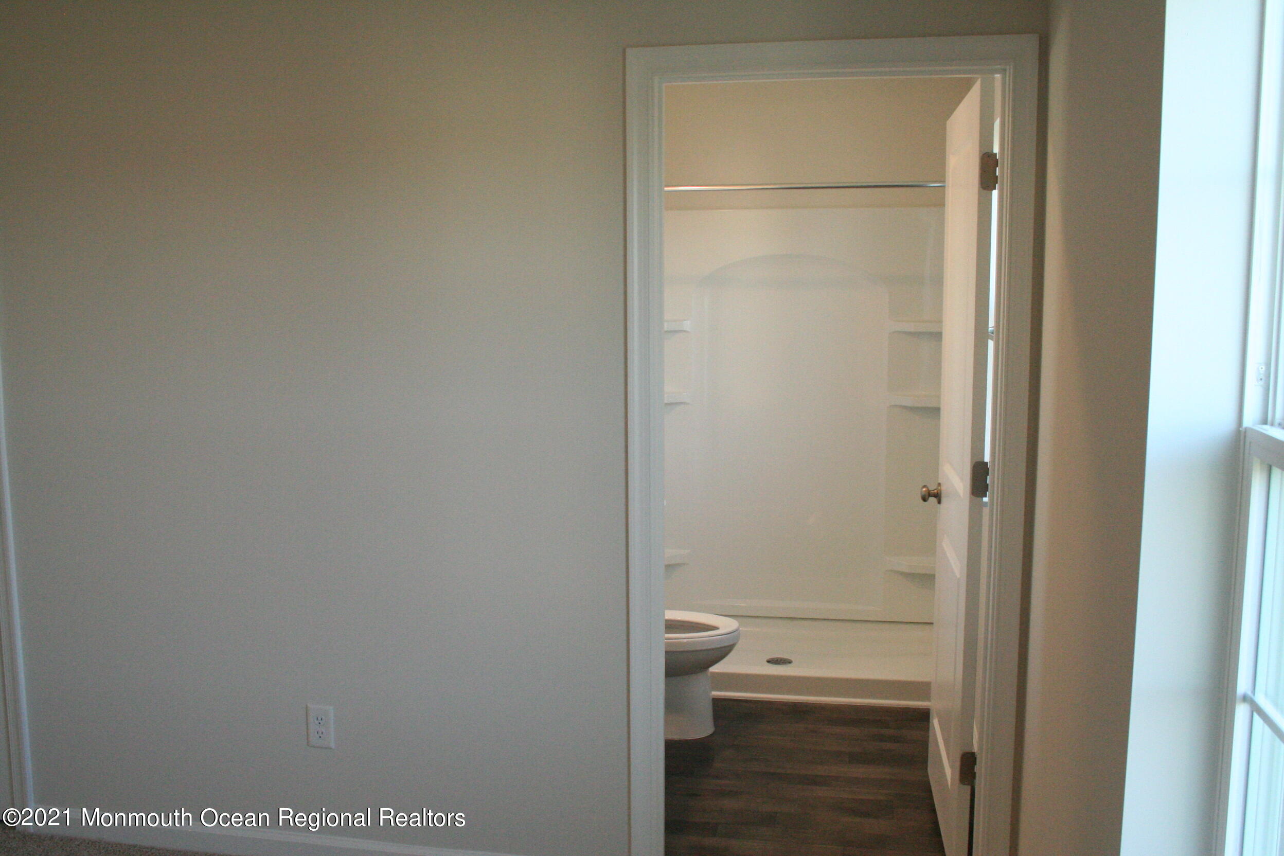107 Cox Road Barnegat, NJ 08005 - Photo 17 of 44 a bathroom with a granite countertop toilet and a shower