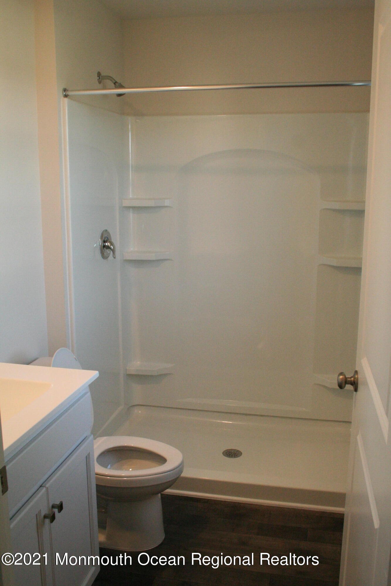 107 Cox Road Barnegat, NJ 08005 - Photo 18 of 44 a bathroom with a toilet a sink and shower