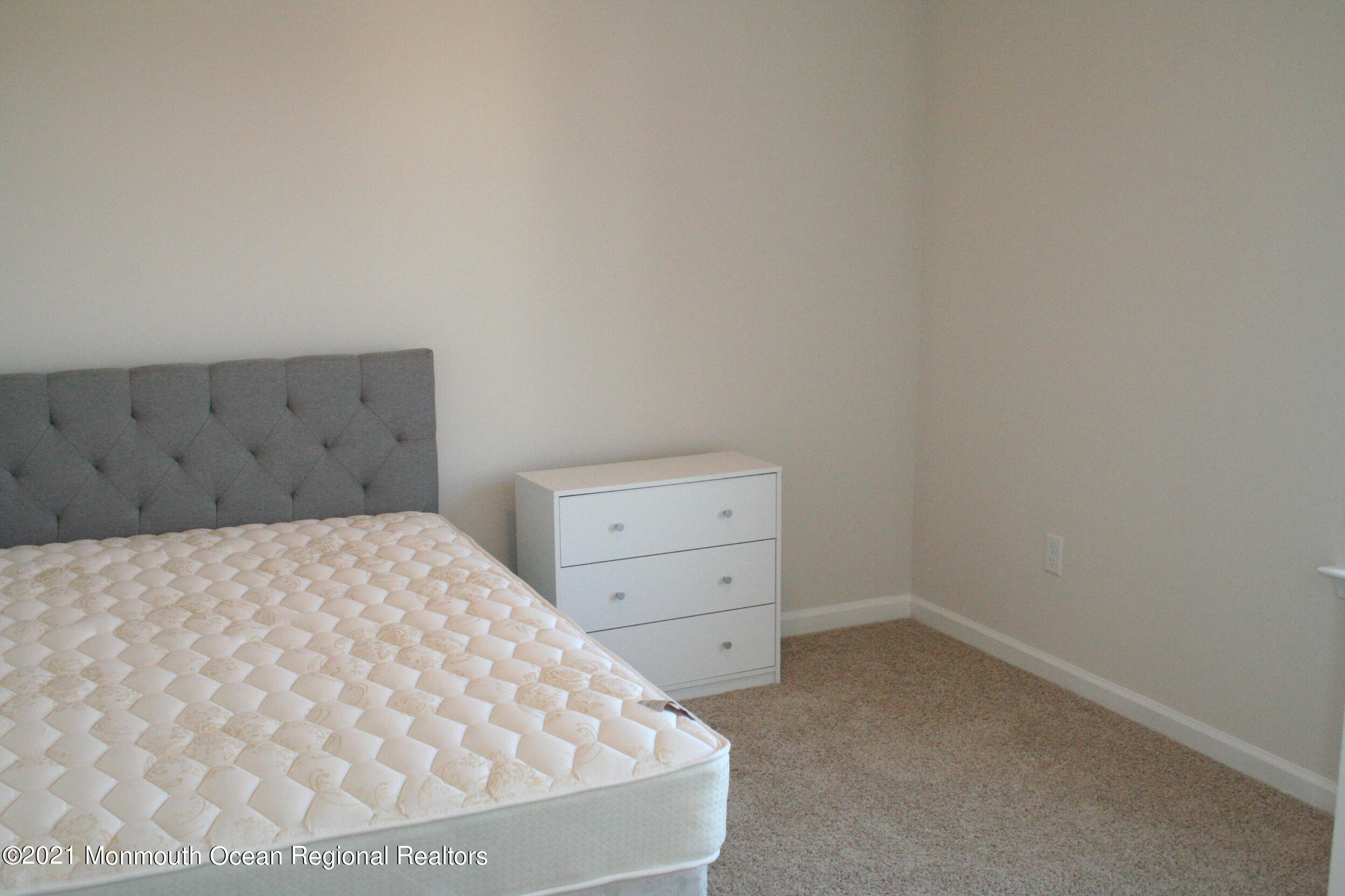 107 Cox Road Barnegat, NJ 08005 - Photo 30 of 44 a room with a bed and cabinet