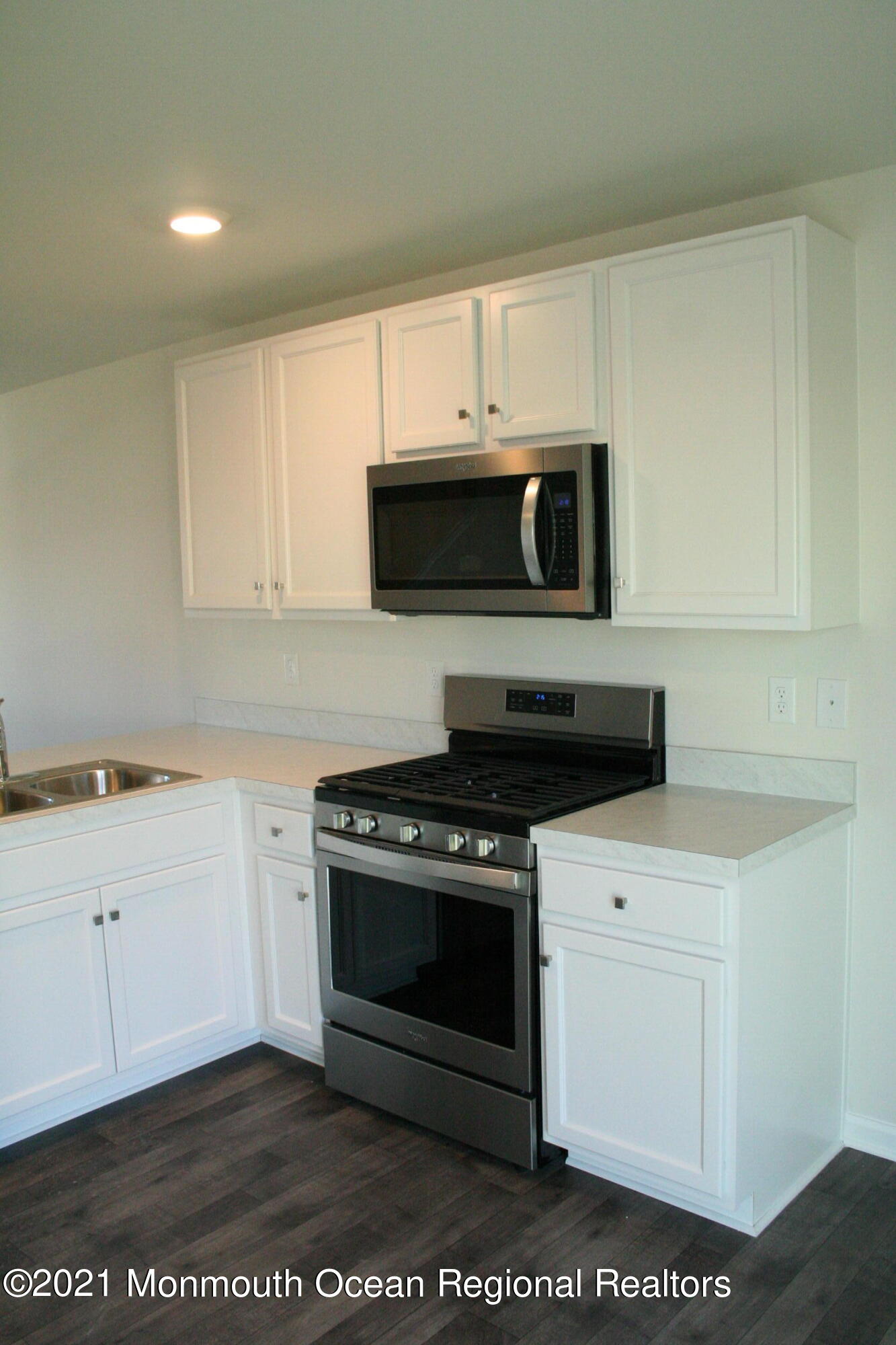 107 Cox Road Barnegat, NJ 08005 - Photo 9 of 44 a kitchen with a stove and a microwave
