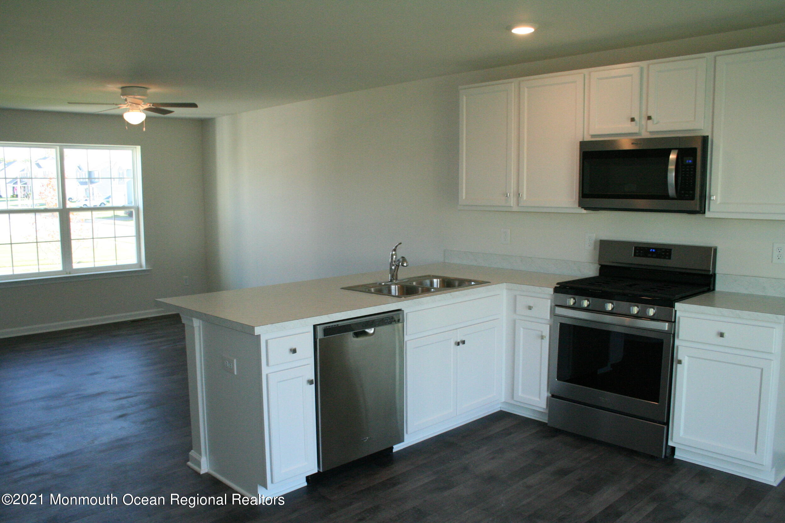 107 Cox Road Barnegat, NJ 08005 - Photo 10 of 44 a kitchen with a sink stove and microwave