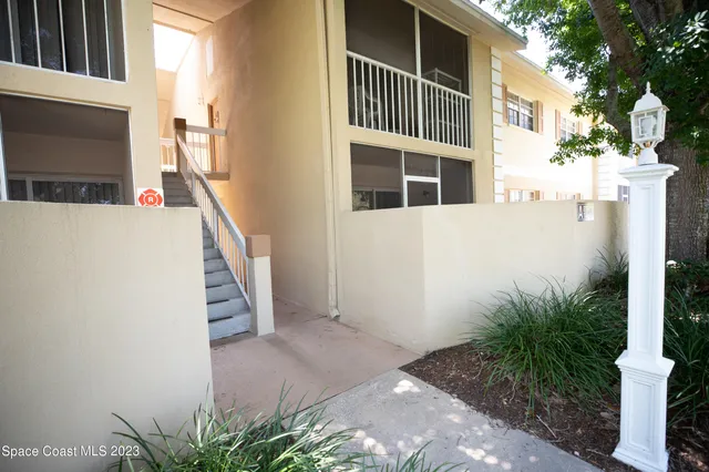 a bedroom with a bed and a mirror