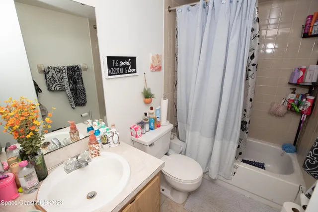 a bathroom with a sink a toilet and tub